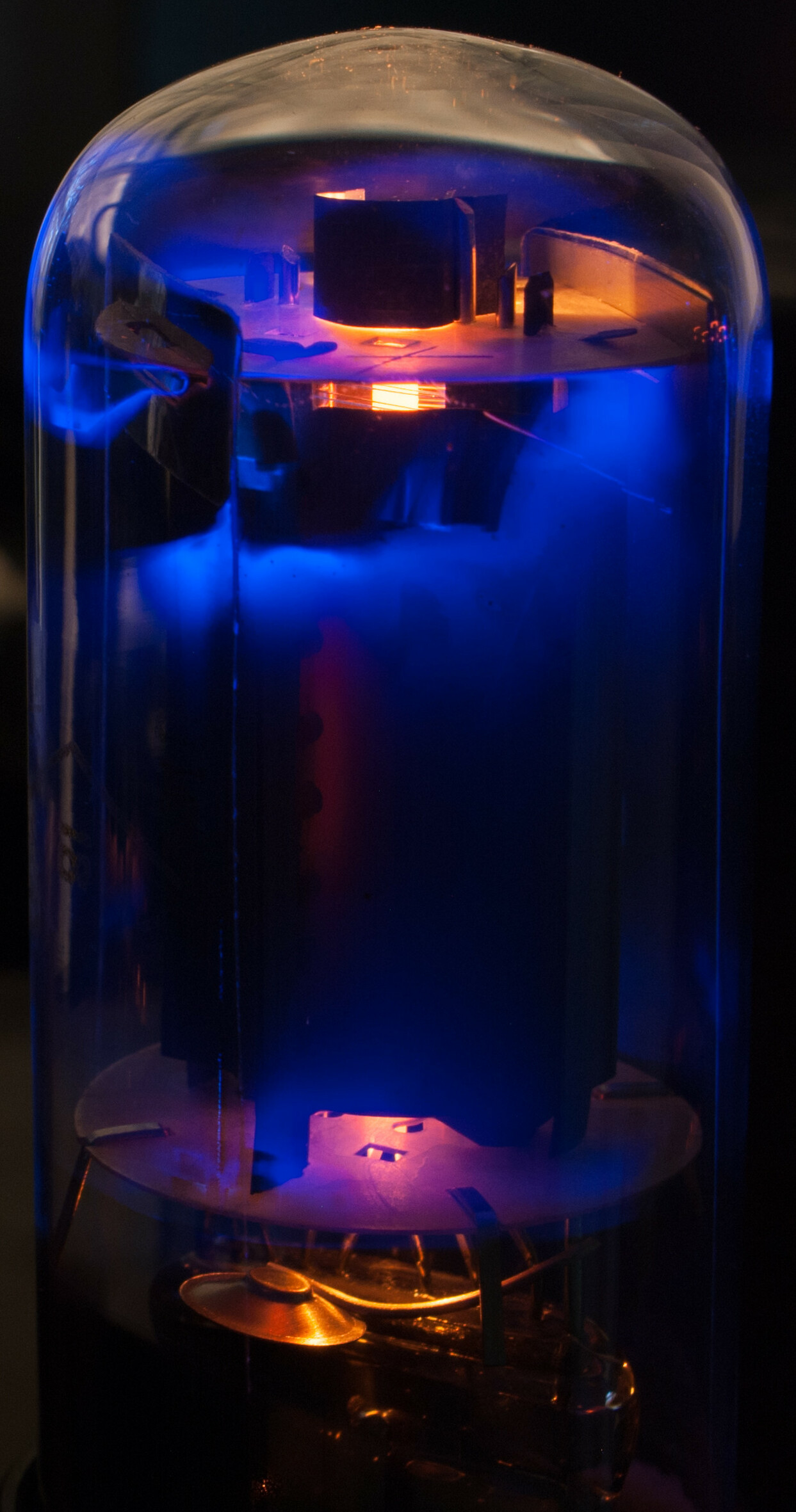 Glowing vaccum power tube type 6N3C of a Fender Bandmaster Reverb guitar tube amplifier