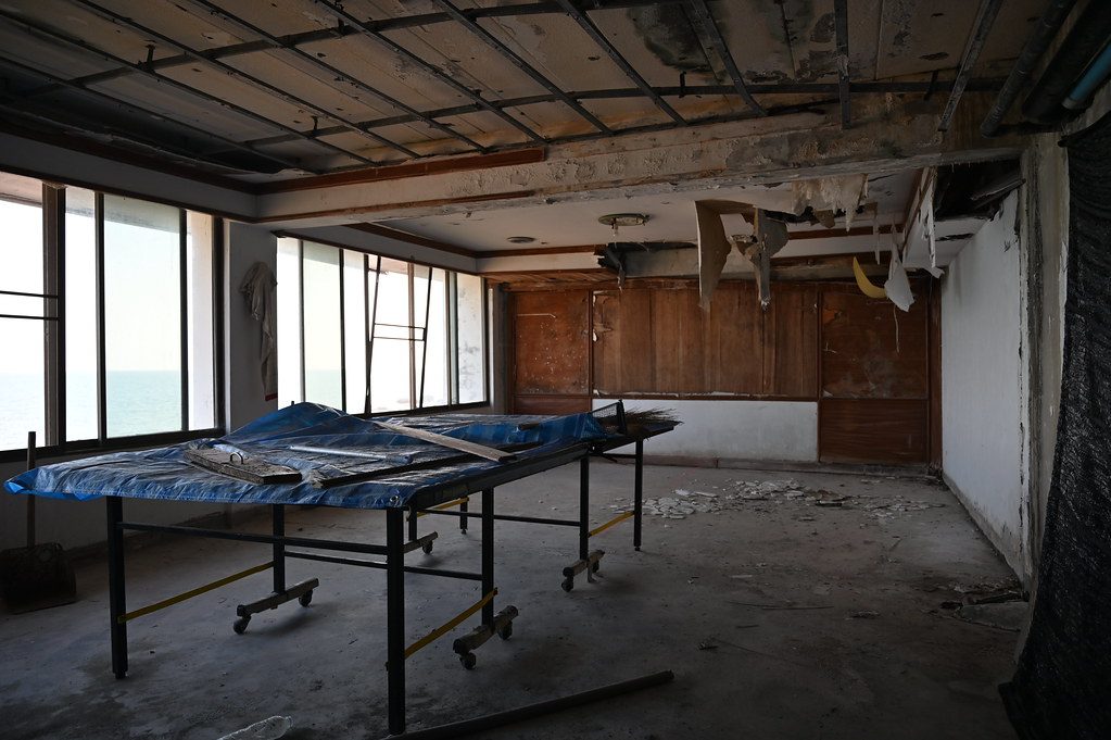 DSC_7591: an empty room with a blue tarp on the floor