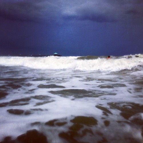Making use of a waterproof phone case. Big waves for Folly.