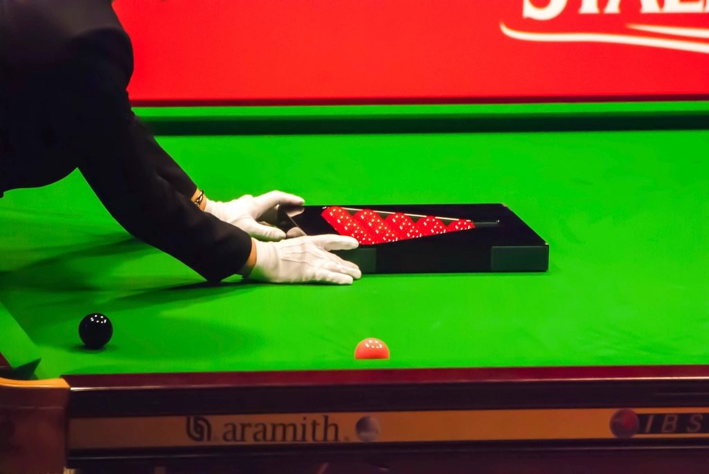 Snooker Referee Arranging the Balls