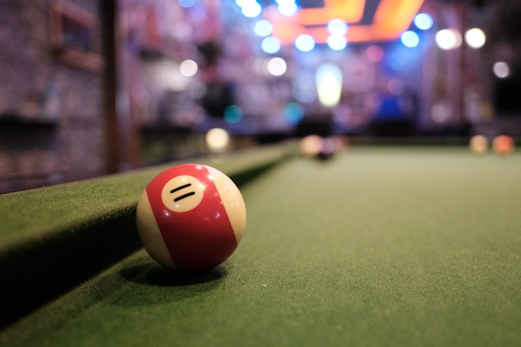 DSCF0418: a pool ball sitting on top of a green pool table