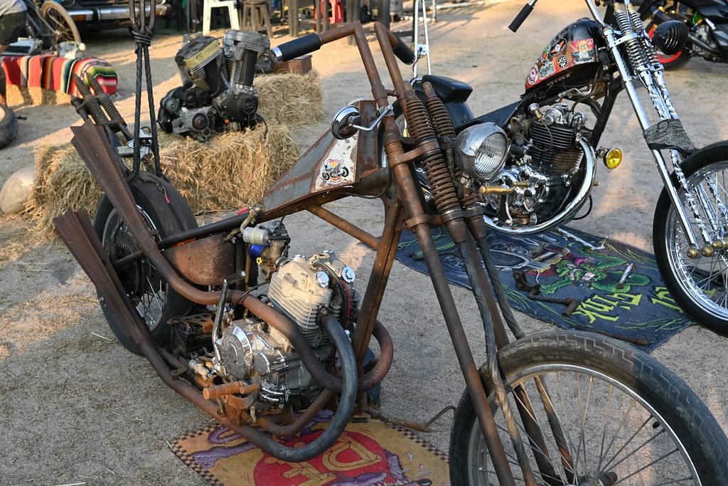 DSC_9371: a motorcycle parked next to a pile of hay