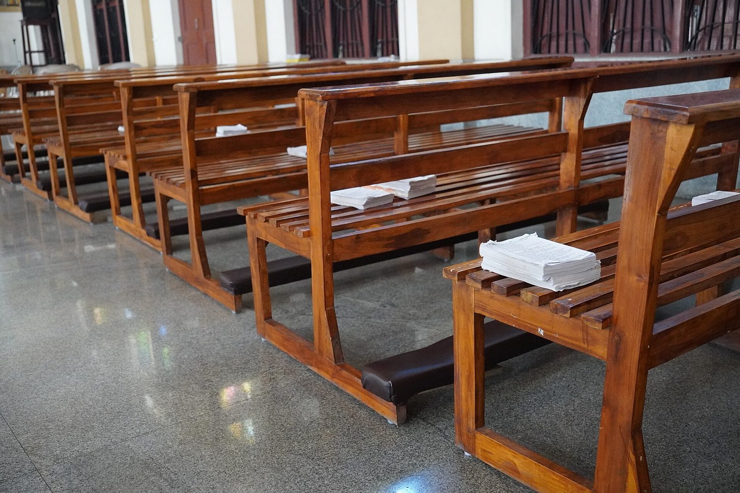 Bible books on benches inside a church