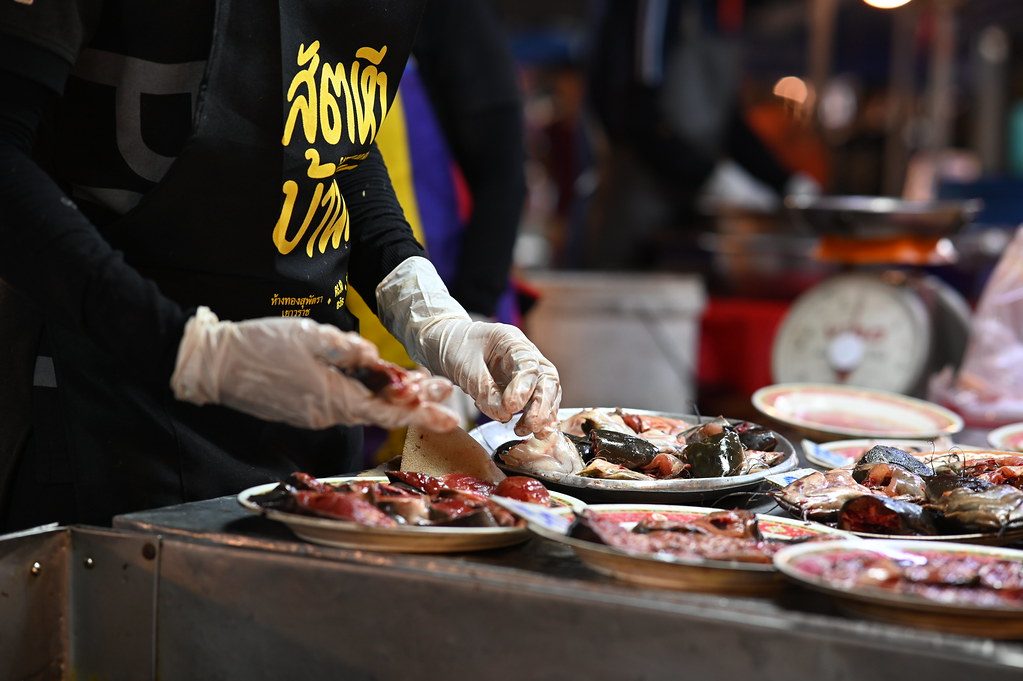 DSC_5816: a person preparing food on a table in a kitchen