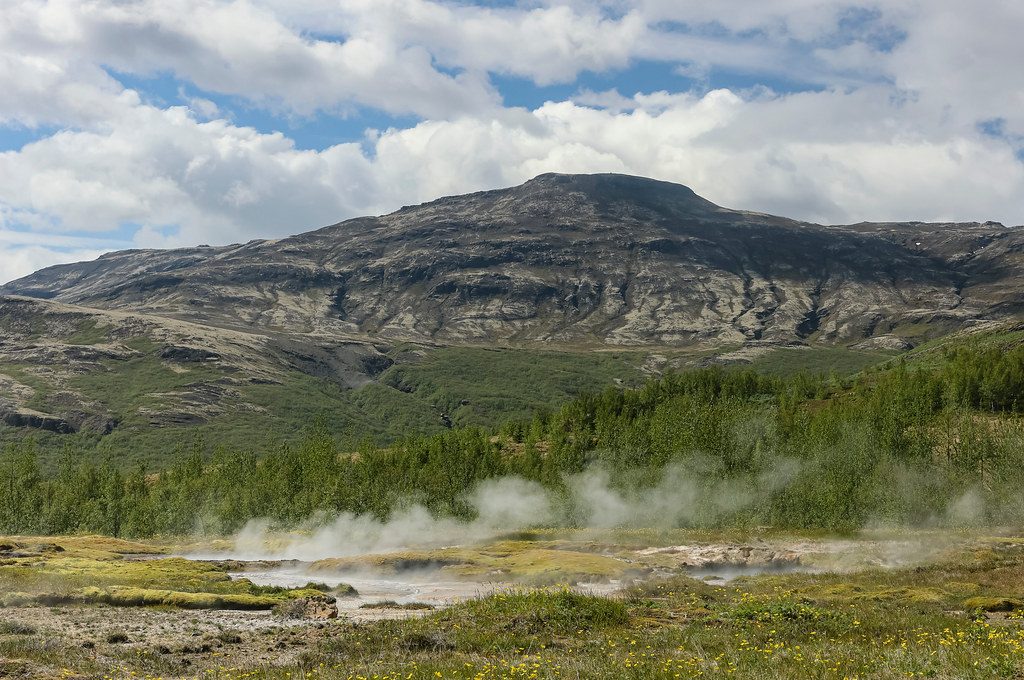 Steamy Subartic: Steam rising from geothermal heated water, Geysir, Iceland, 2024