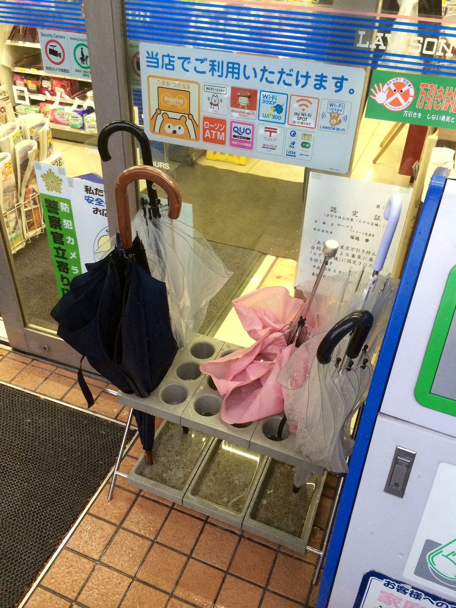 Umbrella holder outside convenience store (14232292011)
